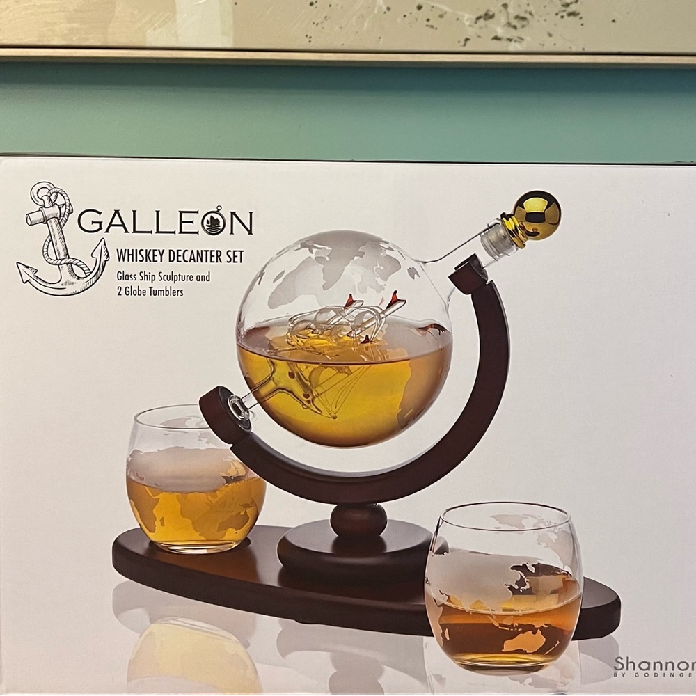 Whiskey Decanter Globe set with 2 etched whiskey glasses.